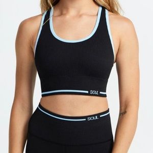 Black Soulcycle sports bra size large with blue stripe